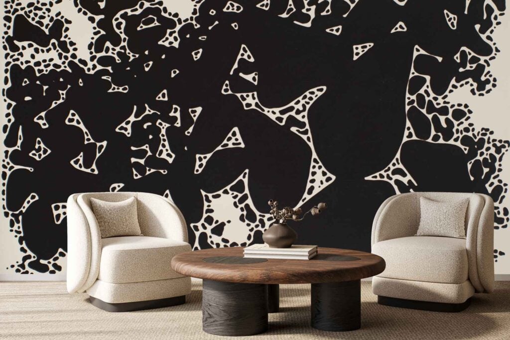 The wallpaper features bold, abstract black and white shapes with organic, irregular forms. This striking mural creates a modern and artistic backdrop with contrasting monochrome elements.