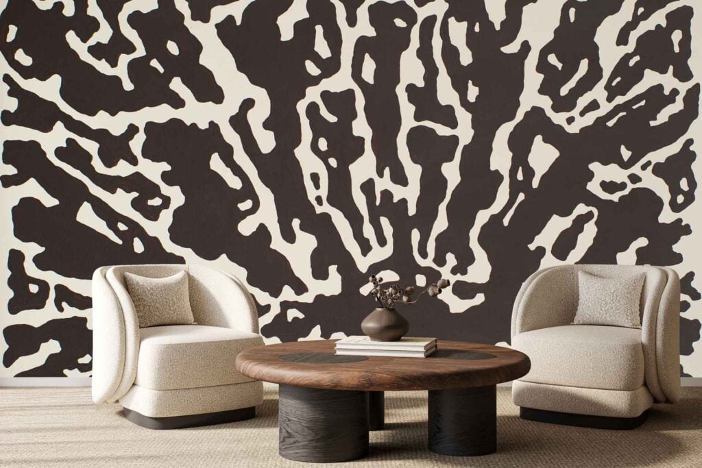 The background wallpaper features a bold, abstract black and white pattern with shapes resembling animal print, making it a striking visual element in the scene.