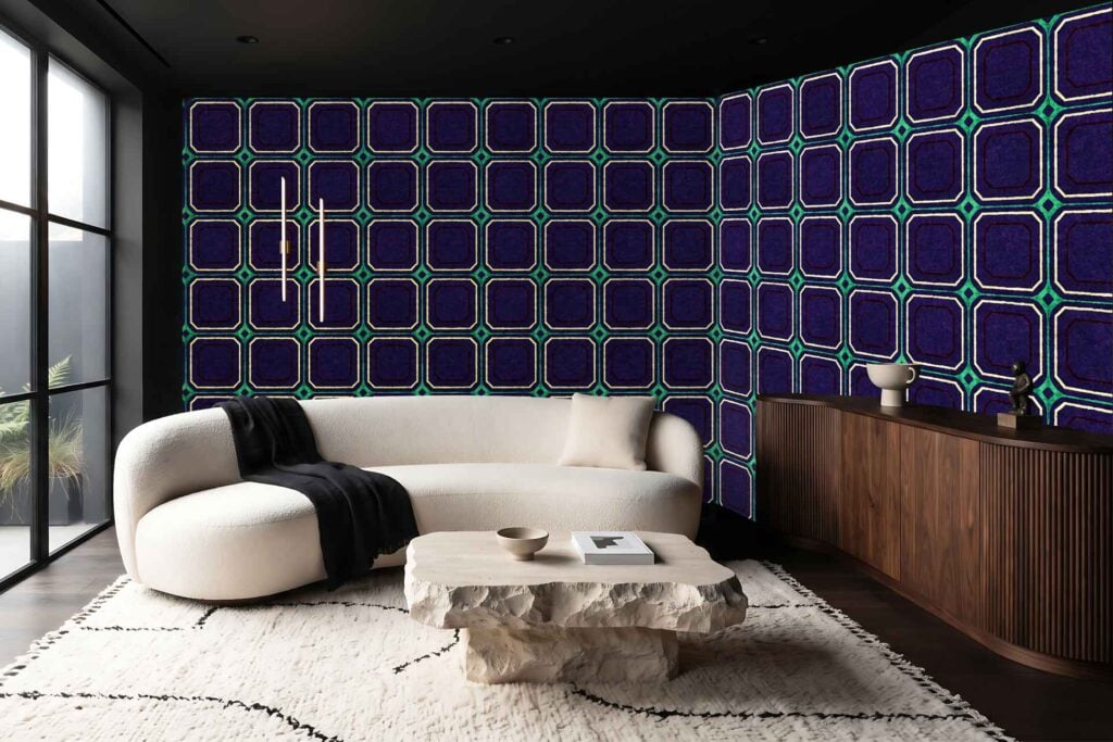 Dark geometric-patterned wallpaper in deep blue and green covers the wall, featuring bold shapes and rich colors.