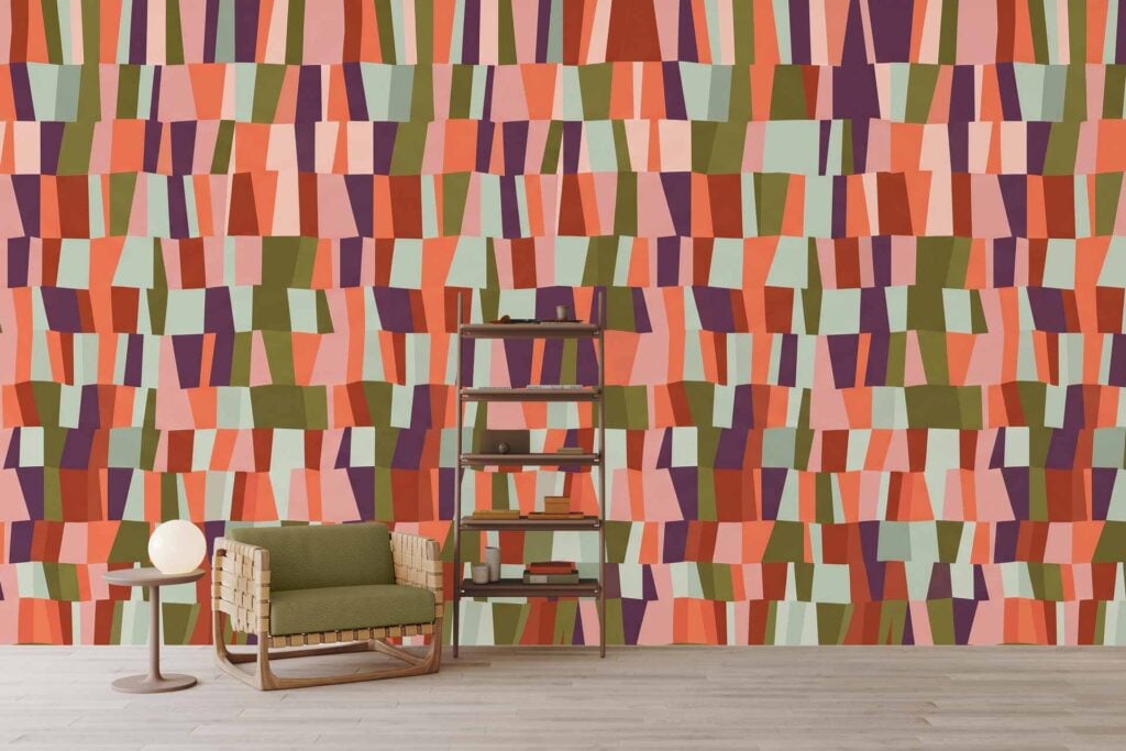 Colorful geometric-patterned wallpaper featuring shades of pink, orange, green, and purple in bold shapes.