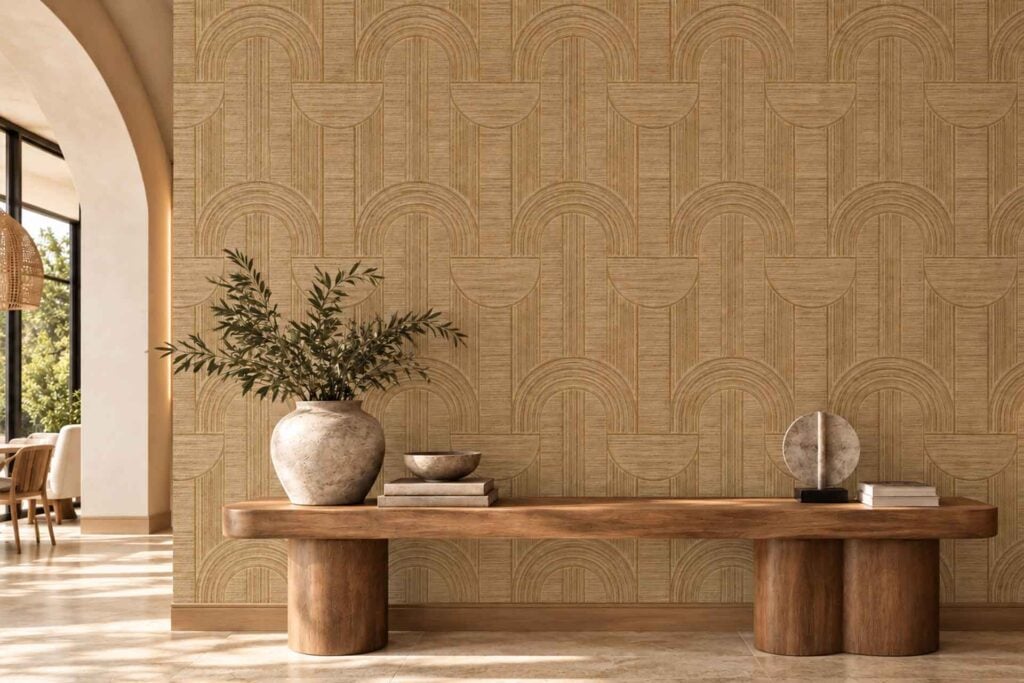 Tan wallpaper with a repeating geometric pattern of interlocking arches and vertical lines.